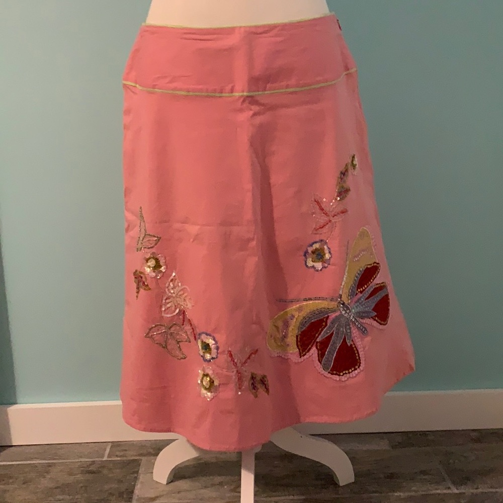 Pink skirt with beaded butterfly and flowers